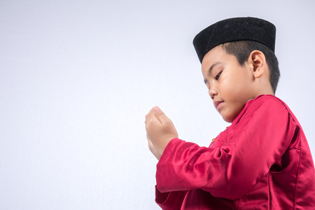 Potrait of young asian muslim boy/girl isolated on white background.の写真素材