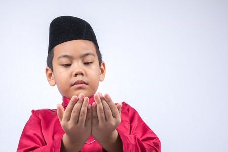 Potrait of young asian muslim boy/girl isolated on white background.の写真素材