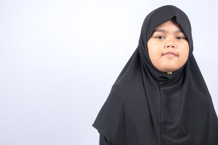 Potrait of young asian muslim boy/girl isolated on white background.の写真素材