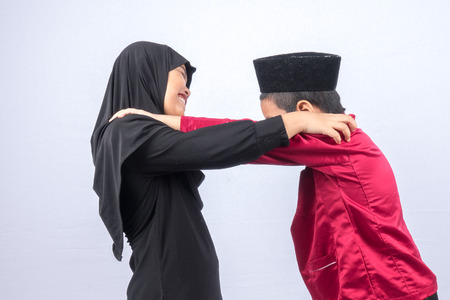 Potrait of young asian muslim boy/girl isolated on white background.の写真素材