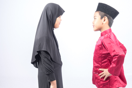 Potrait of young asian muslim boy/girl isolated on white background.の写真素材