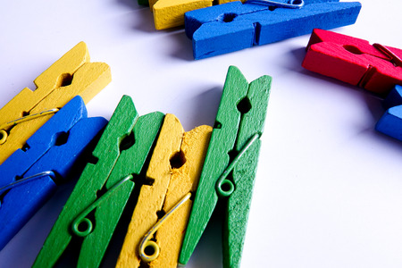 Colorful clothespins isolated on a white background.