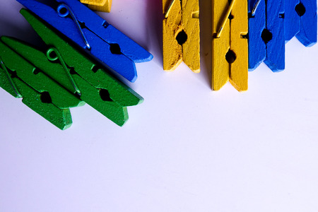 Colorful clothespins isolated on a white background.の写真素材