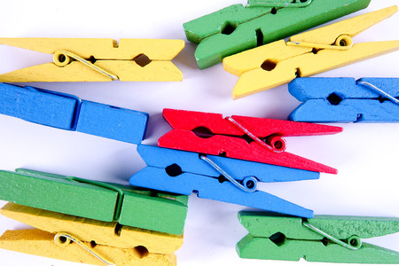 Colorful clothespins isolated on a white background.の写真素材