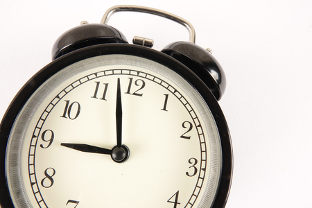 Time Punctuality Concept with black alarm clock.