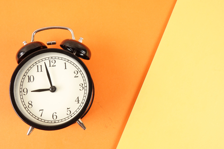 Time Punctuality Concept with black alarm clock.の写真素材