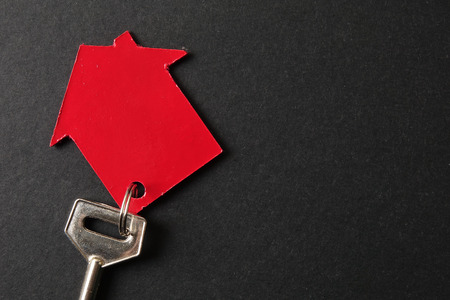 Property/housing ownership concept with red small house and steel key.の写真素材
