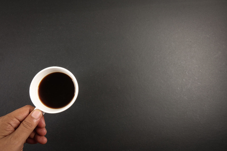 Office leather desk table with coffee cup. Top view with copy spaceの写真素材