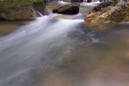 Waterfall/stream in a deep rain forest.の写真素材