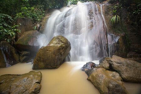 Waterfall/stream in a deep rain forest.の写真素材