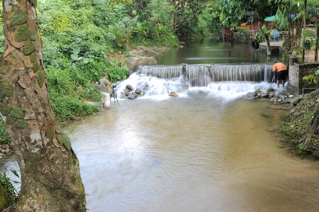 Waterfall/stream in a deep rain forest.の写真素材