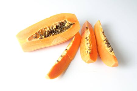 Half and slices papaya isolated on white.の写真素材