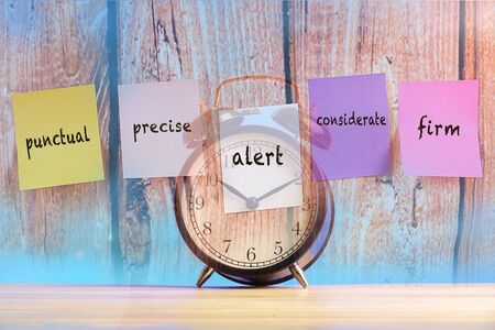 Time management concept :Double exposure images with alarm clock over wooden background.の写真素材