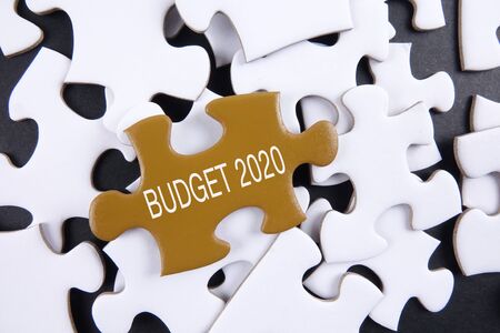 Budget 2020 printed on gold puzzle over white puzzle backgroundの写真素材