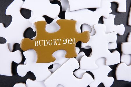 Budget 2020 printed on gold puzzle over white puzzle backgroundの写真素材