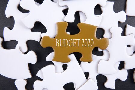 Budget 2020 printed on gold puzzle over white puzzle backgroundの写真素材