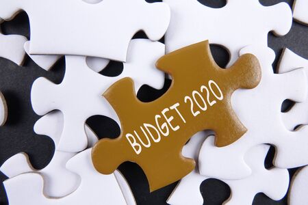 Budget 2020 printed on gold puzzle over white puzzle backgroundの写真素材