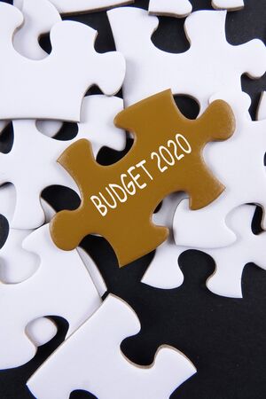 Budget 2020 printed on gold puzzle over white puzzle backgroundの写真素材