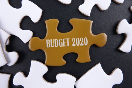 Budget 2020 printed on gold puzzle over white puzzle backgroundの写真素材