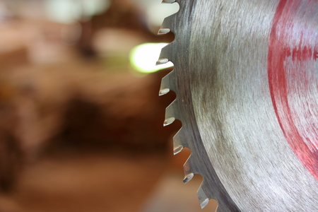 Close up circular saw blade on blurred background