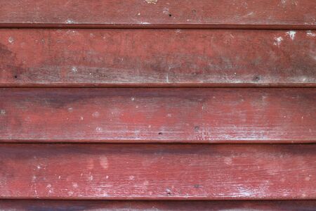 Old red wood plank backgroundの写真素材