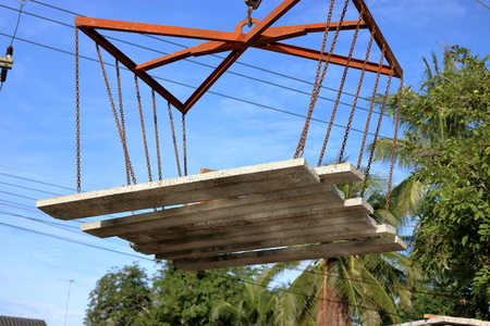 Concrete slabs floating in the sky, Control by mobile craneの写真素材