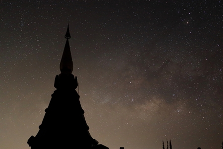 Amazing scenery of silhouette pagoda with milky way on night sky background.の写真素材