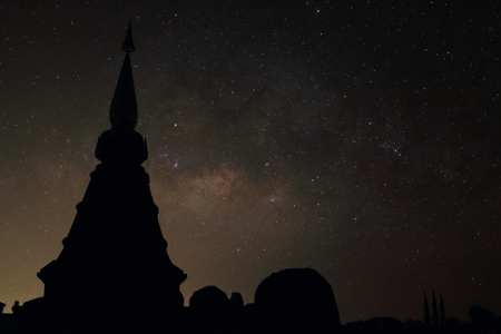 Amazing scenery of silhouette pagoda with milky way on night sky background.の写真素材