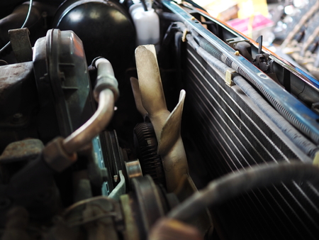 Close up cooling fan in old car engineの写真素材