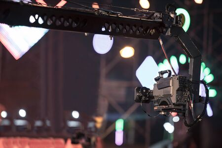 Professional digital camera in crane recording video in music concert festivalの写真素材