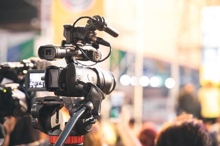 Professional video camera with abstract blurred background