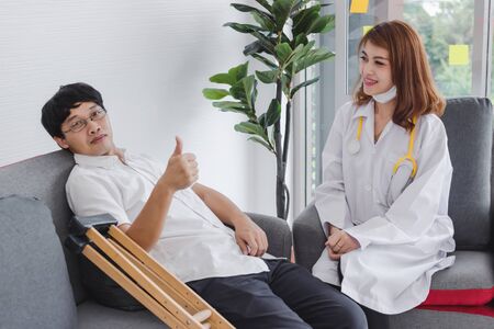 Young Asian doctor consulting patient in hospital office. Health care and medical concept....