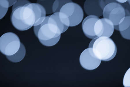 Abstract blurred blue bokeh lights backgroundの写真素材