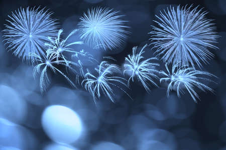 Blue firework and blurred bokeh light with copy space in Christmas and New Year. Abstract background holiday concept.の写真素材