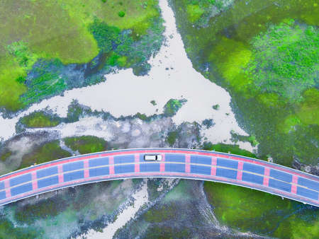 Aerial view of Chalerm Phra Kiat road or Ekachai Bridge cross the lake at Phatthalung, Thailandの写真素材