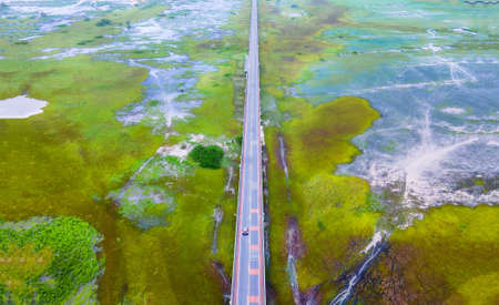 Aerial view of Chalerm Phra Kiat road or Ekachai Bridge cross the lake at Phatthalung, Thailandの写真素材