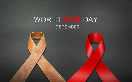 Red ribbon and ribbon made from brown leather in AIDS day conceptの写真素材