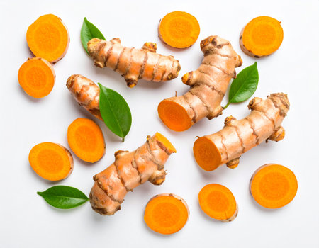 Fresh turmeric root and slices on white background. Top view.の素材