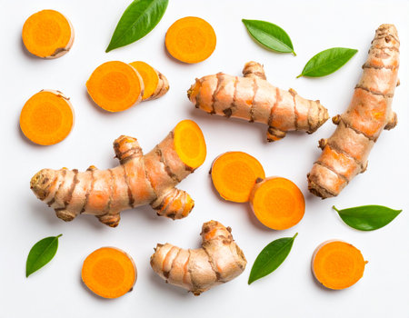 Fresh turmeric root and slices on white background. Top view.の素材
