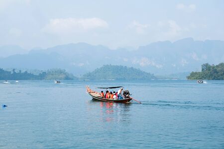 Long-tail boat on Cheow Lan Lake, Khao Sok National Park in southern Thailandの写真素材