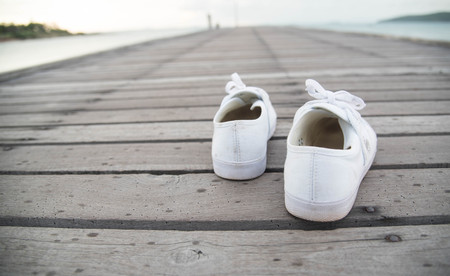 canvas shoes on old pieaの写真素材