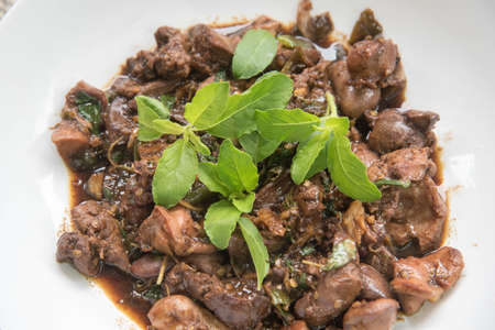 Fried basil leave with chicken innardsThai foodの写真素材