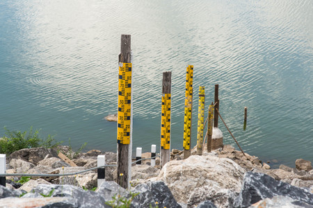 Water level pole at Krasiao dam. Suphanburi province, Thailand.の写真素材