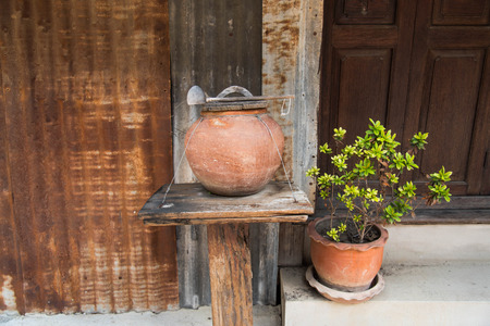 Thai clay water pot with dipper made from coconut shellの写真素材