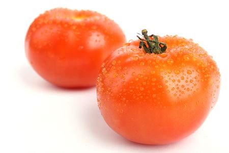 Close up two tomato isolated on white backgroundの写真素材