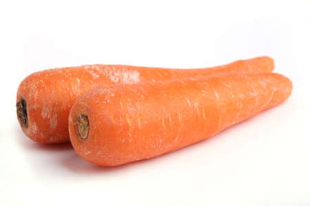 Close up Two Carrot isolated on white backgroundの写真素材