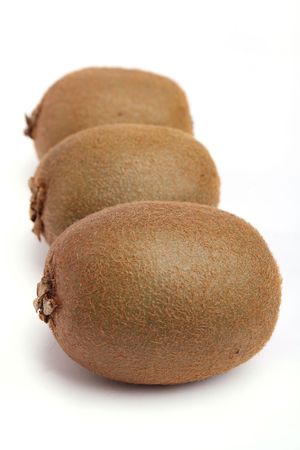 Close up three kiwi isolated on white backgroundの写真素材