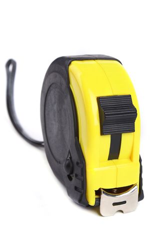 A tape measure isolated on a white background. の写真素材