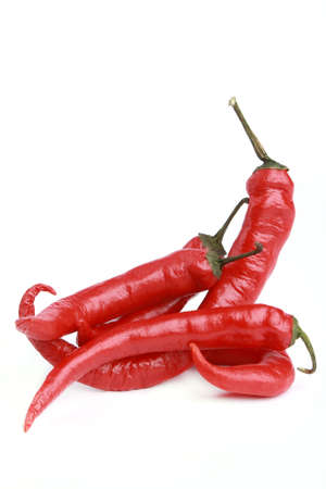 Five Red chili pepper isolated on white backgroundの写真素材