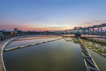 sedimentation basin, sewage flowing through large tanks